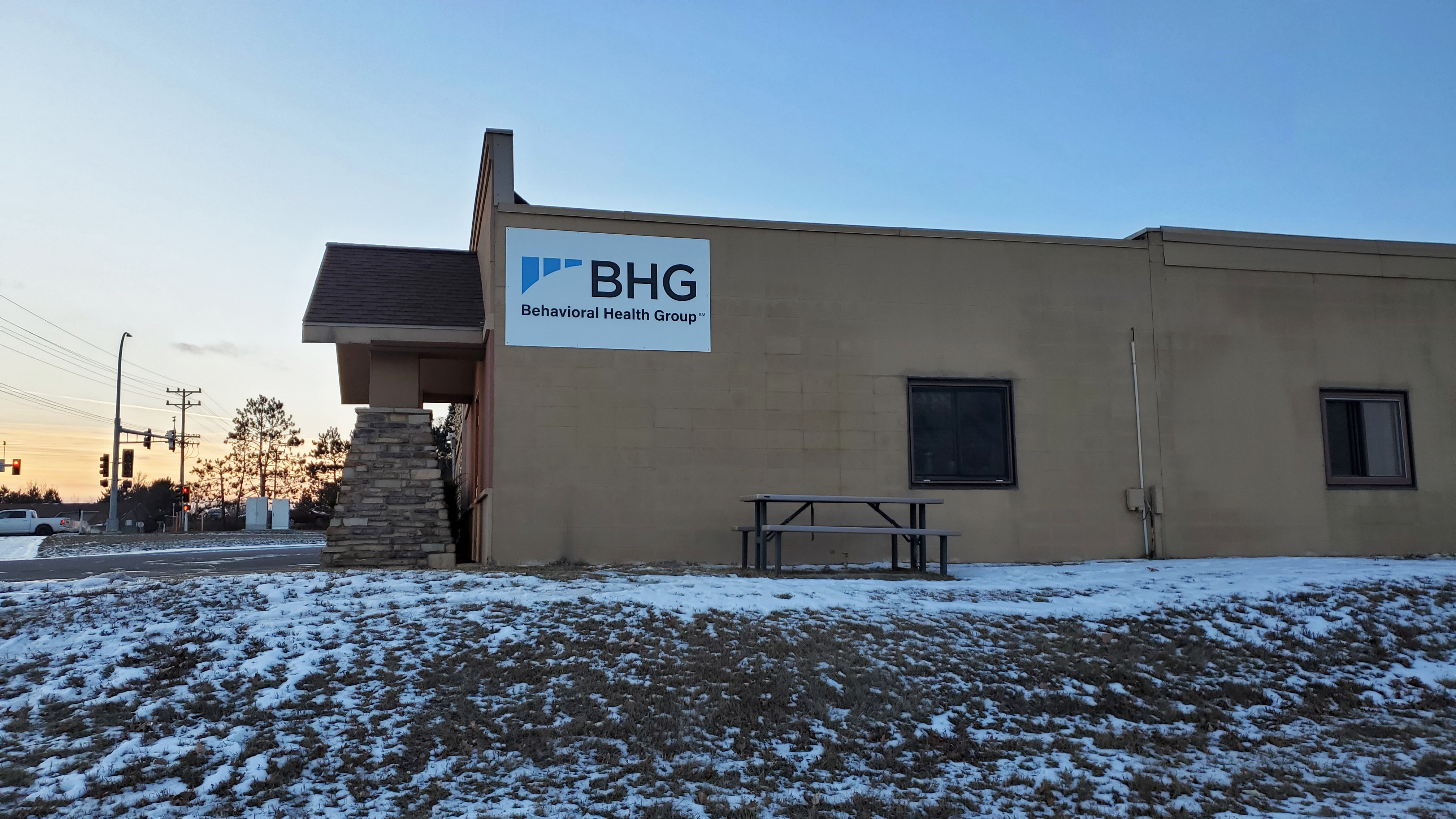Side view of the treatment center building with BHG sign