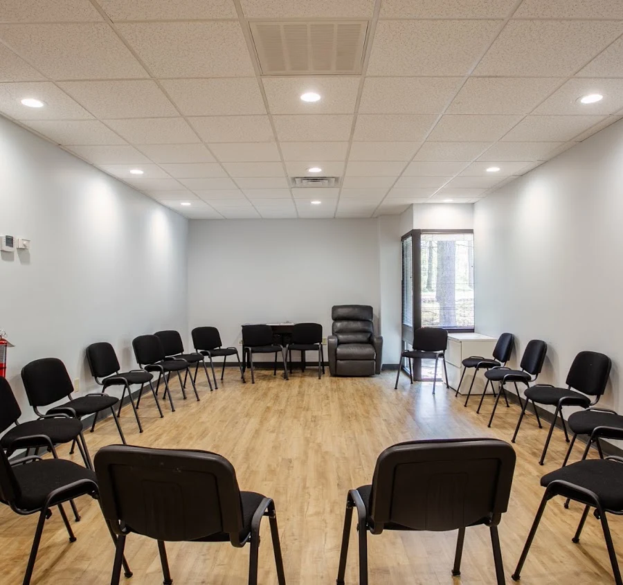 Group therapy room with chairs arranged in a large circle