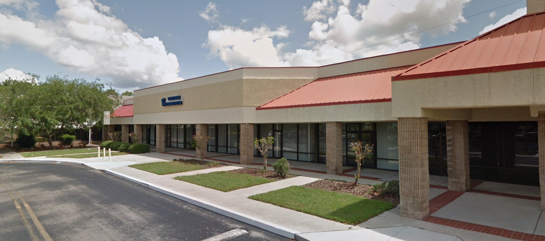 Facility exterior driveway with entrance.