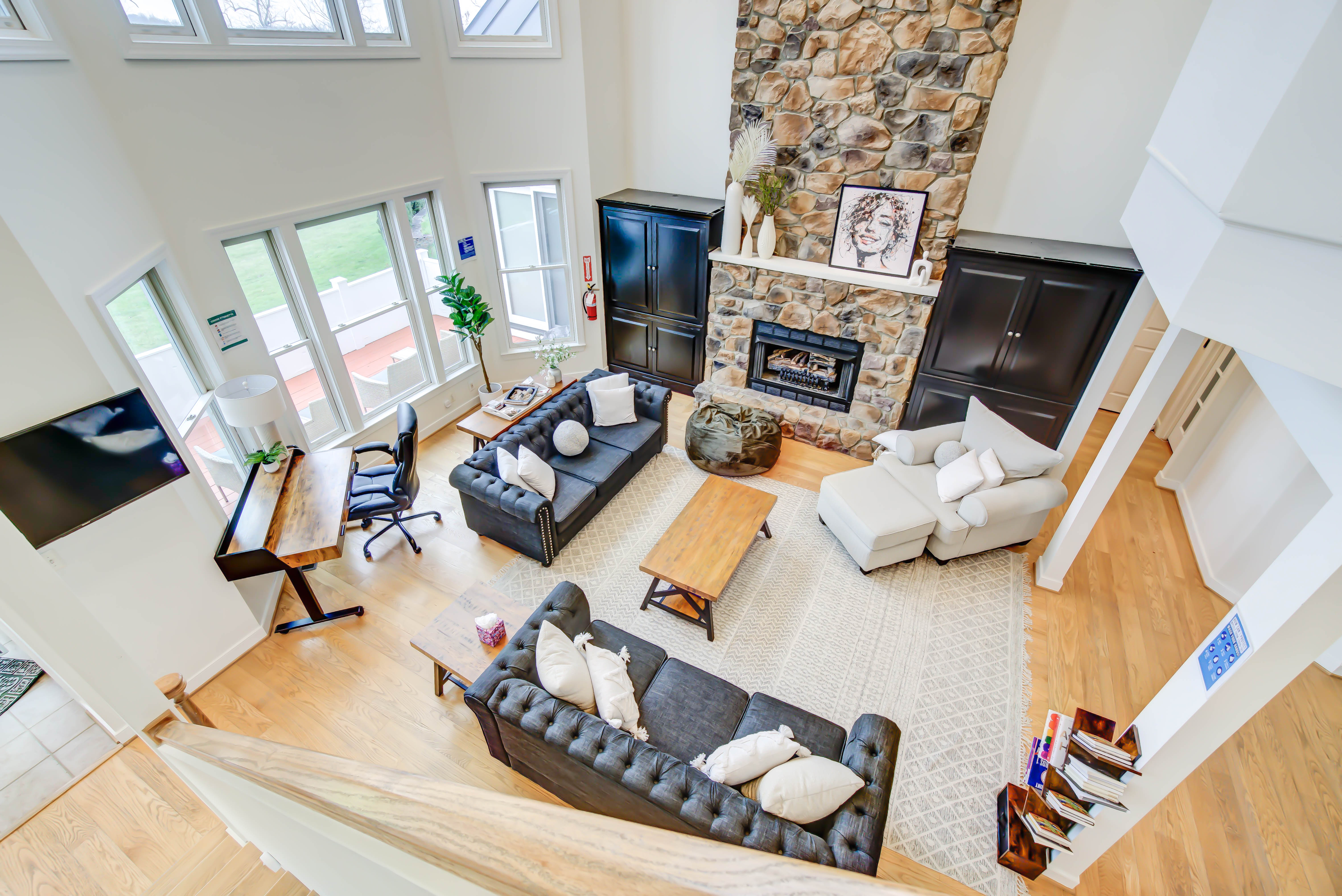 View from above of lounge with fireplace and seating