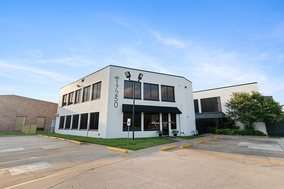White two-story rehab center building with large front windows