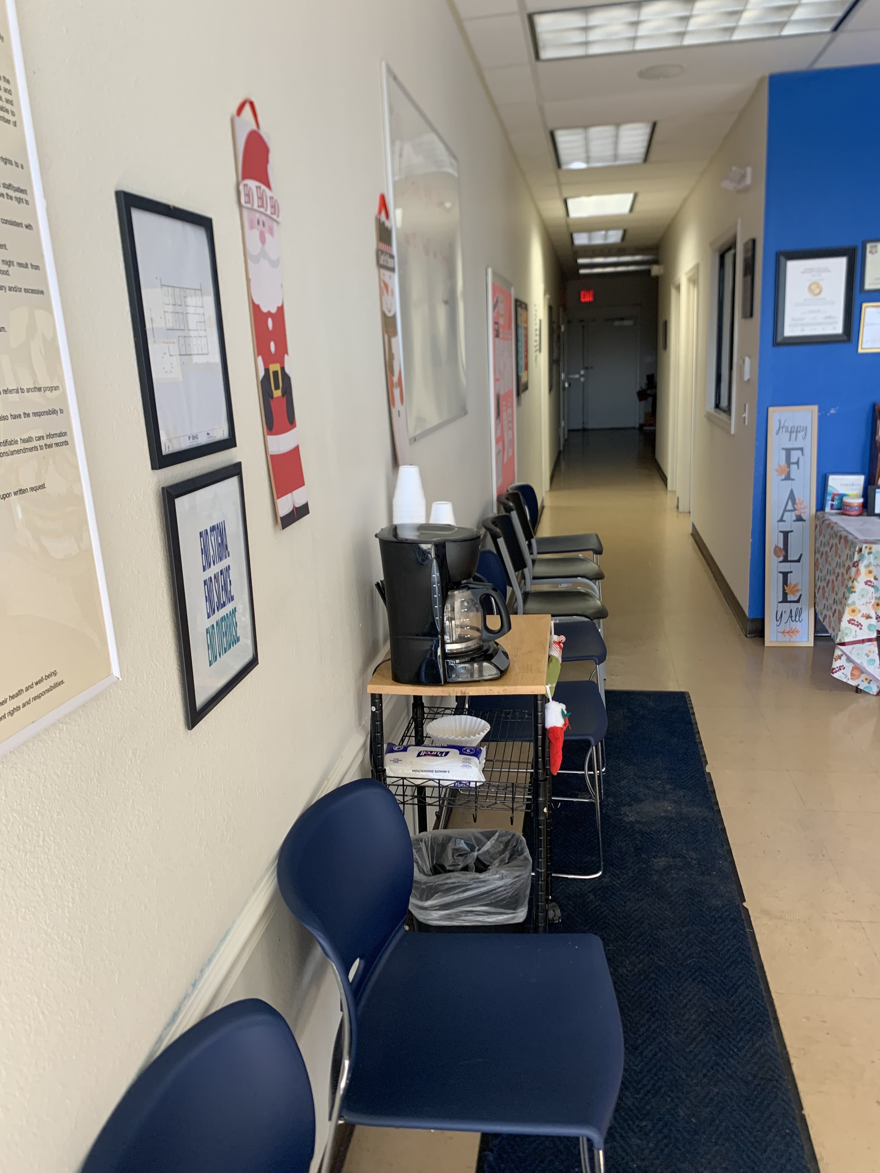 Hallway with waiting chairs and coffee station