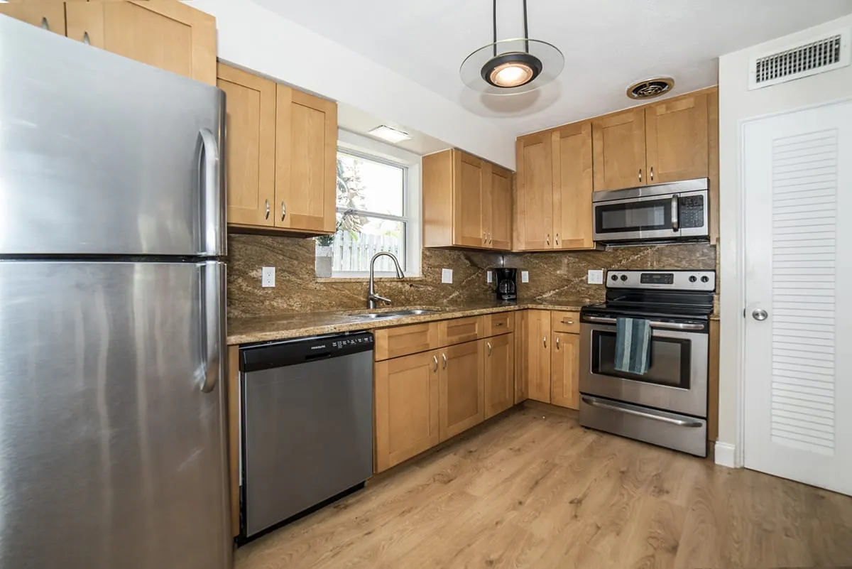 Modern kitchen with wood cabinets and stainless steel appliances