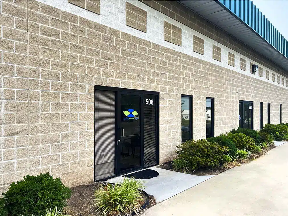 Clinic building entrance with landscaped walkway