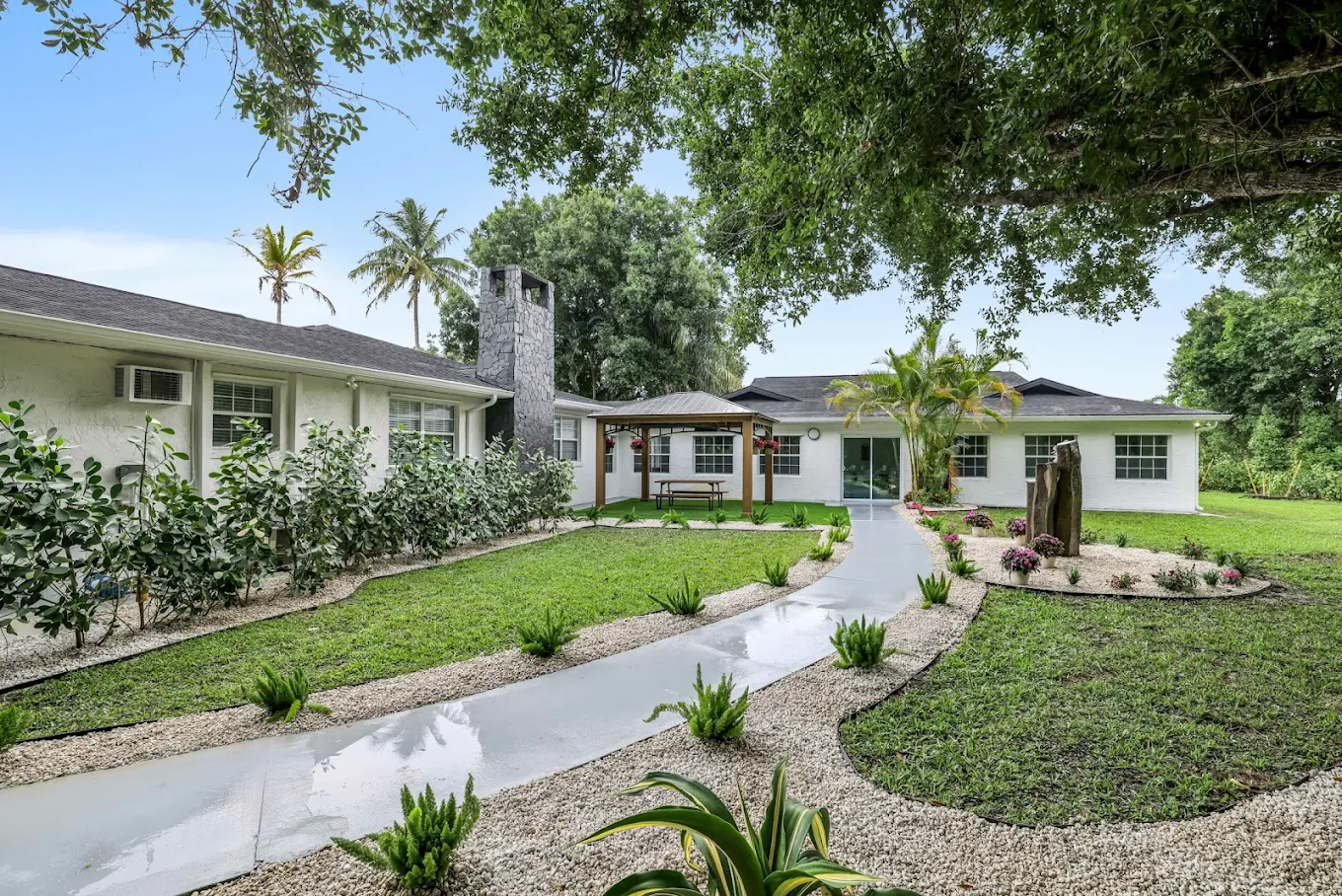 Landscaped courtyard with walking paths and gardens
