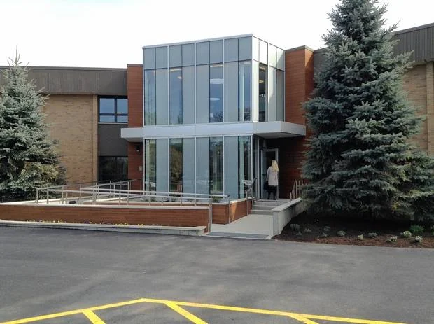 Modern glass entryway with accessible ramp