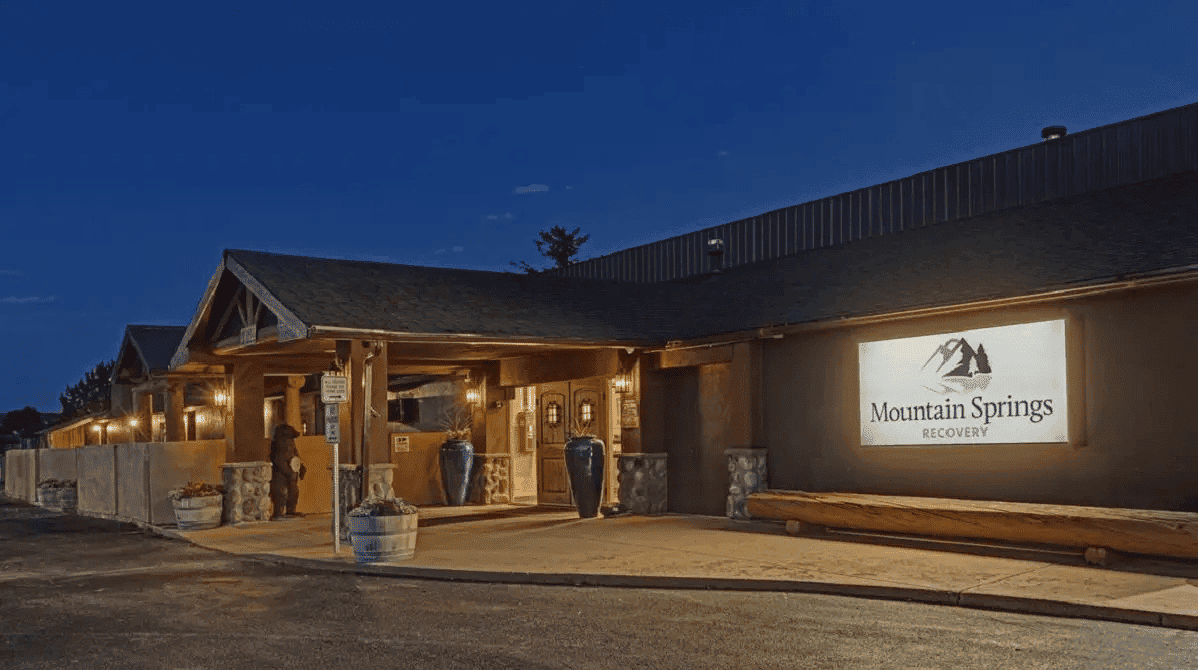 Entrance to facility with signage on building.