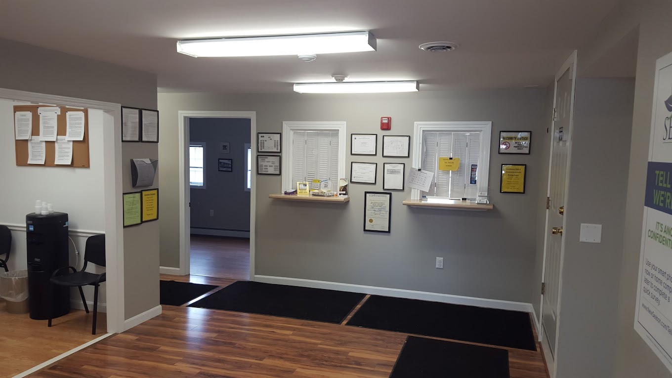 Lobby with reception window and offices in view.