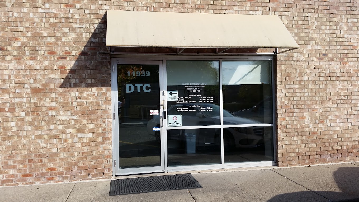 Entrance with glass doors and signage.