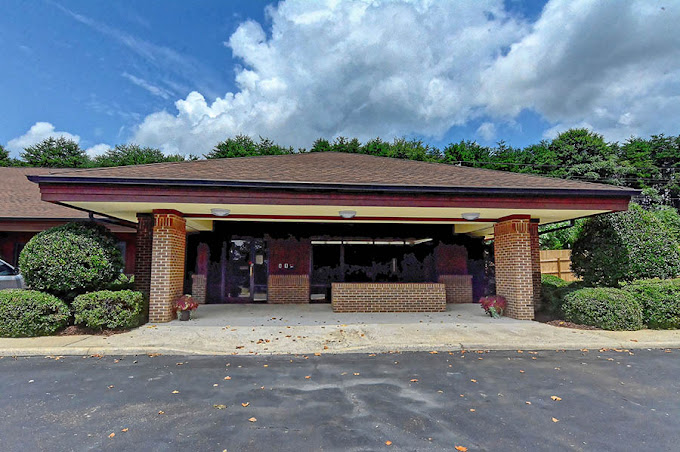 Covered entrance with brick columns at main entrance