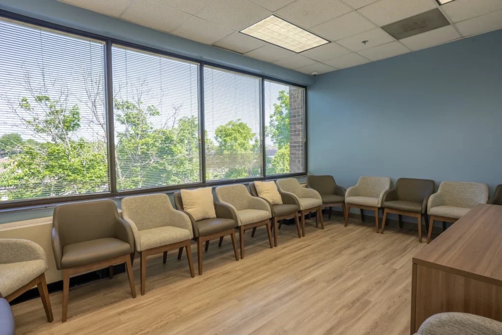 Group room with chairs arranged along large windows
