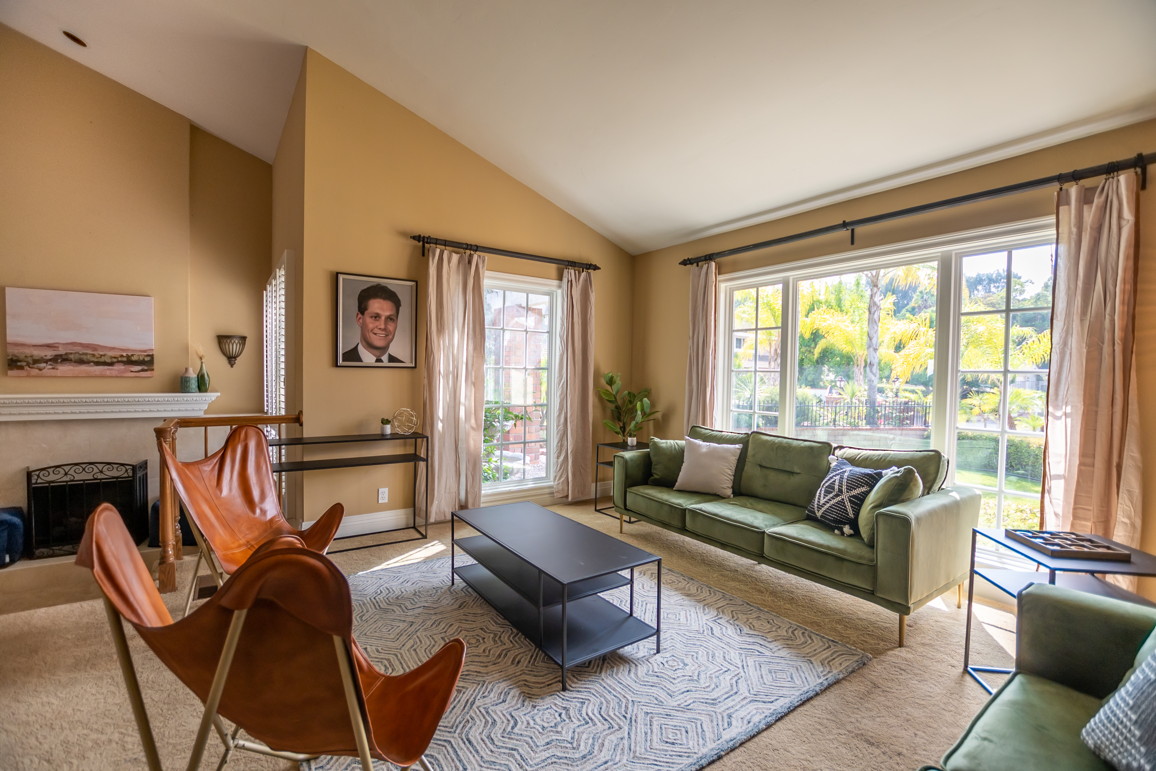 Warm living room with sofas and large windows