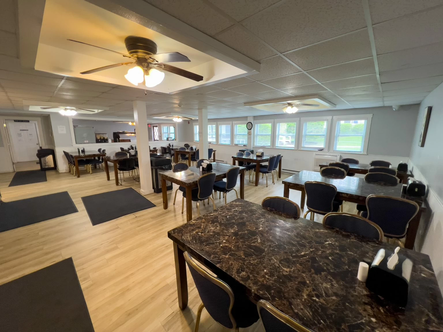 Spacious dining area with multiple tables and chairs