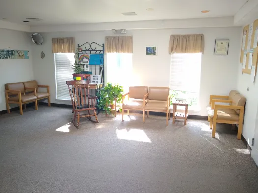 Bright lobby with seating and potted plants