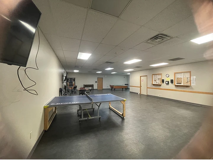 Recreational area featuring a ping pong table and pool table.
