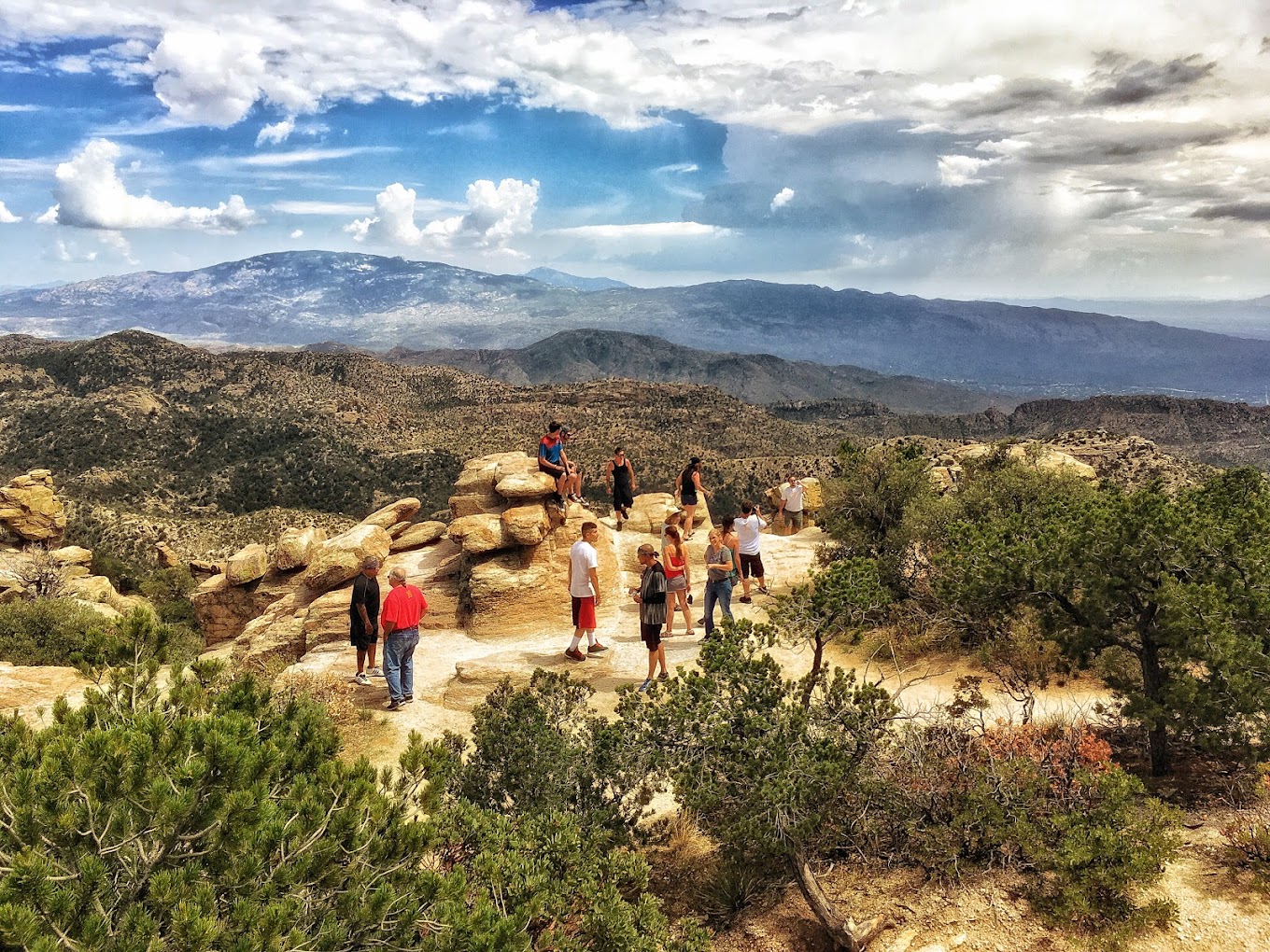 Group hiking in a scenic mountain landscape.