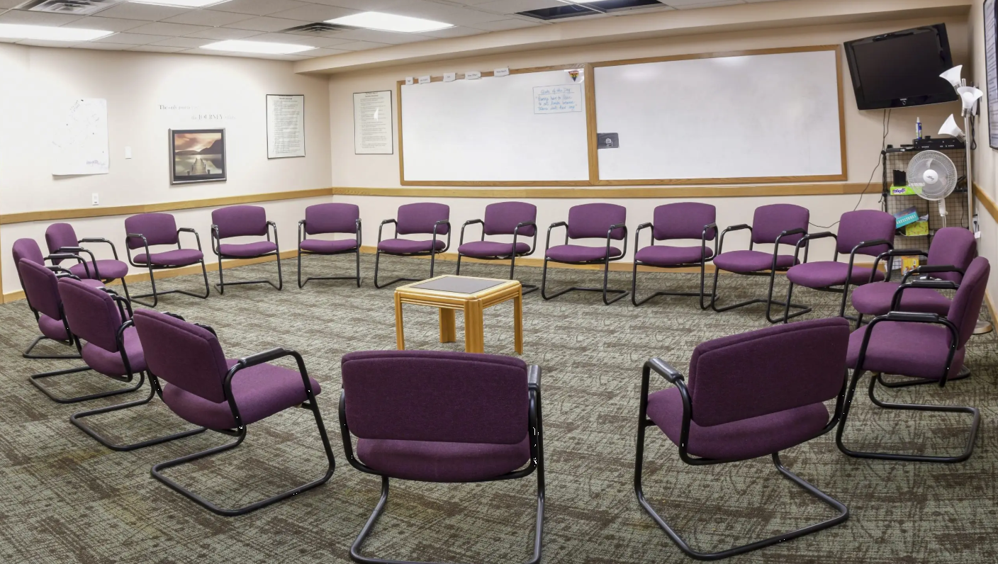 Group therapy room with chairs arranged in a circle