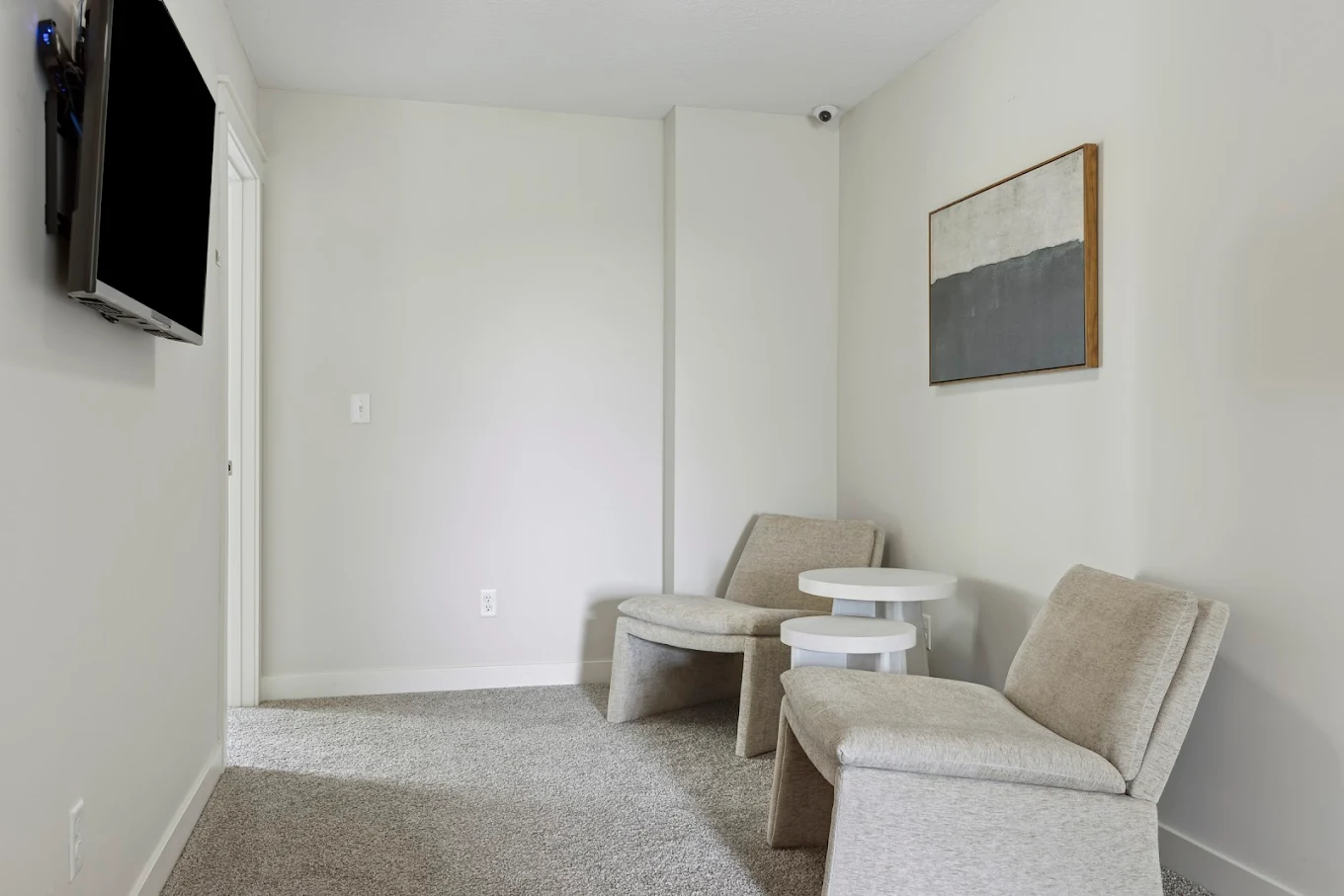 Small therapy room with two chairs and table