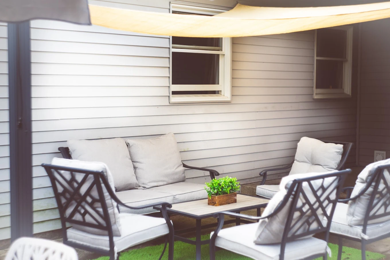 Outdoor seating area with chairs and shaded patio space