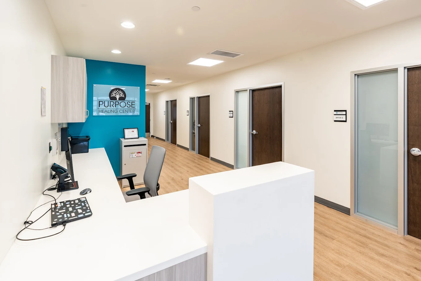 Front desk with office doors along hallway