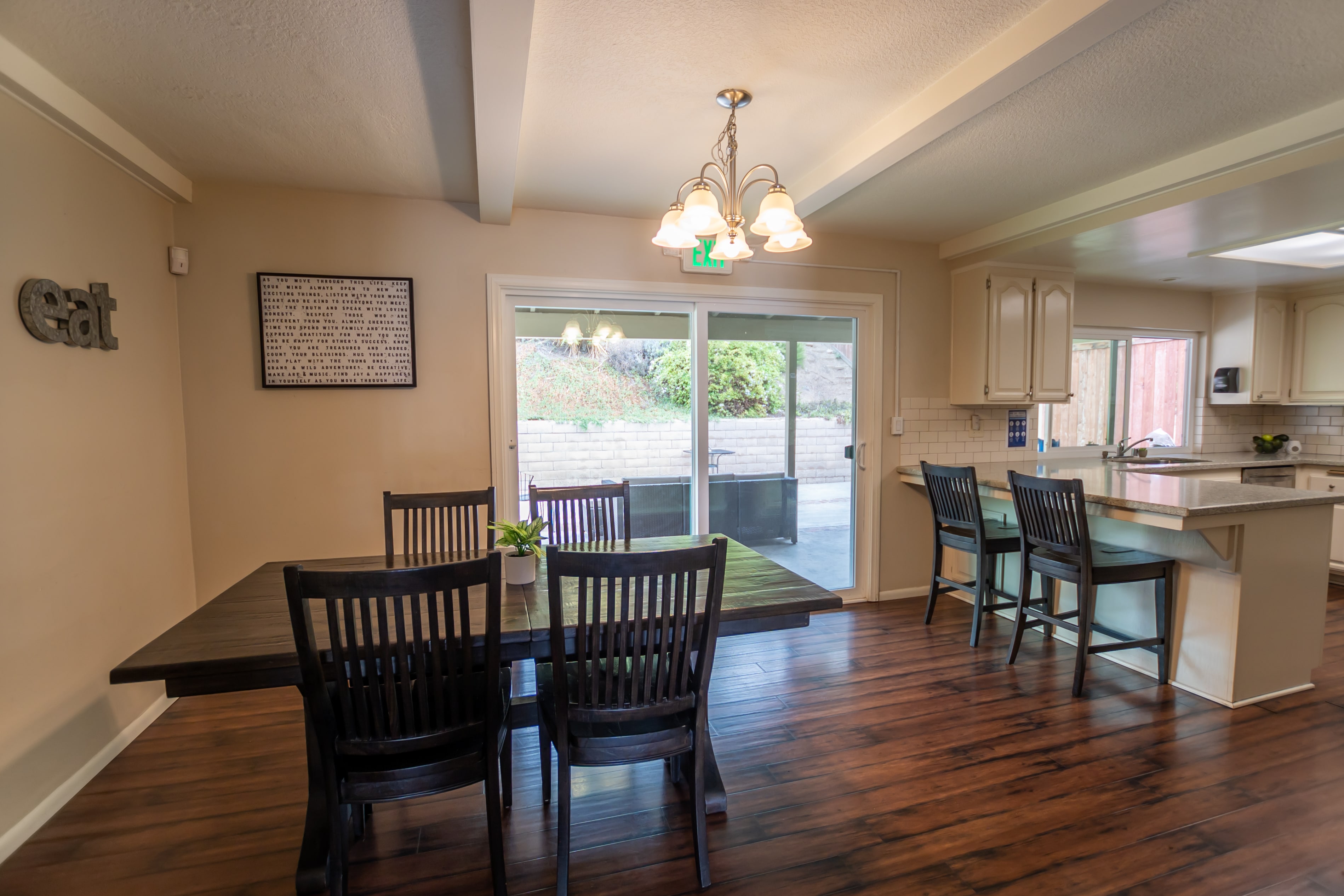 Dining table and kitchen with patio view