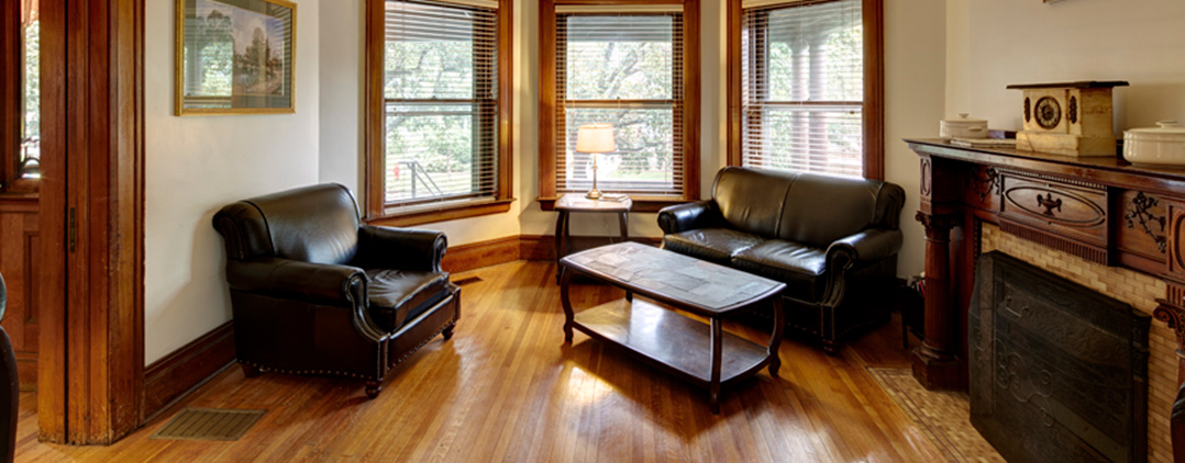 Cozy lounge with leather seating and large windows