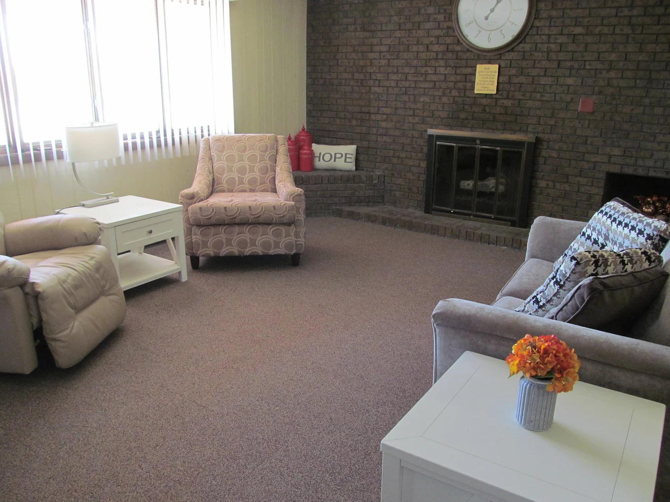Quiet sitting area with chairs and fireplace