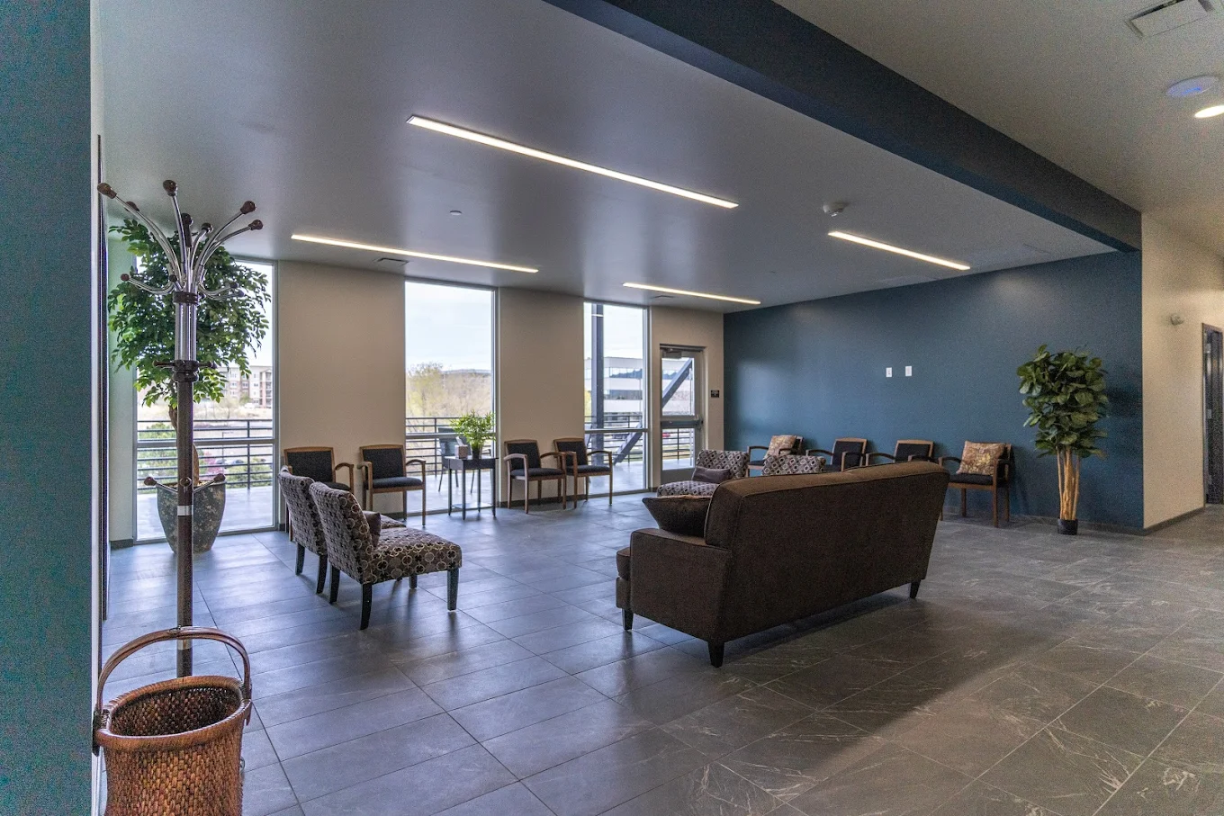 Lounge with brown sofas and coffee table near dining area