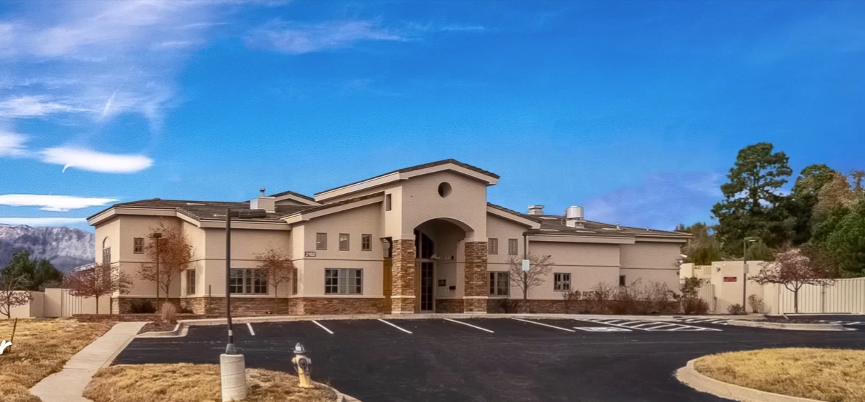 Facility exterior with accessible parking.