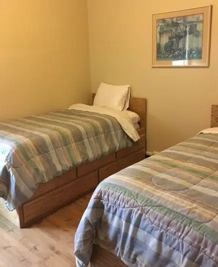 Shared bedroom with two twin beds at Janus residential program.