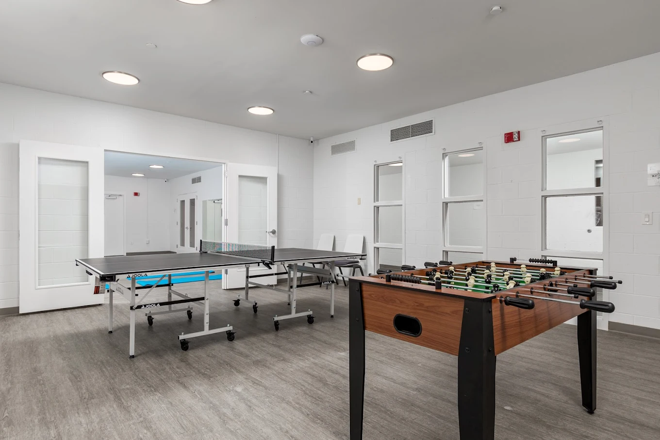 Game room with ping pong and foosball tables