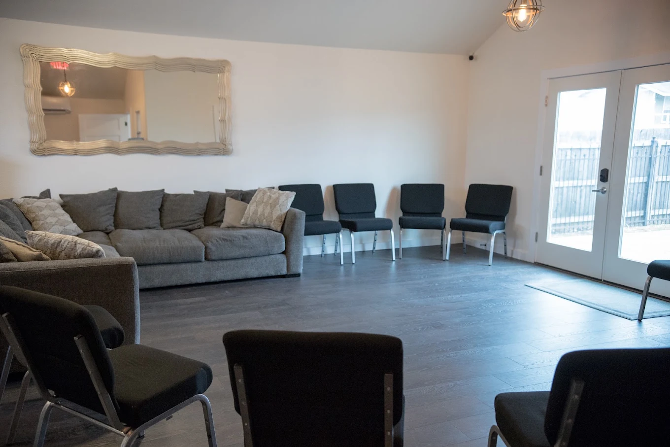 Group room with sofa and chairs arranged for gatherings