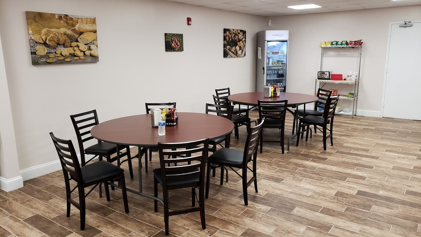 Dining area with round tables and snack station.