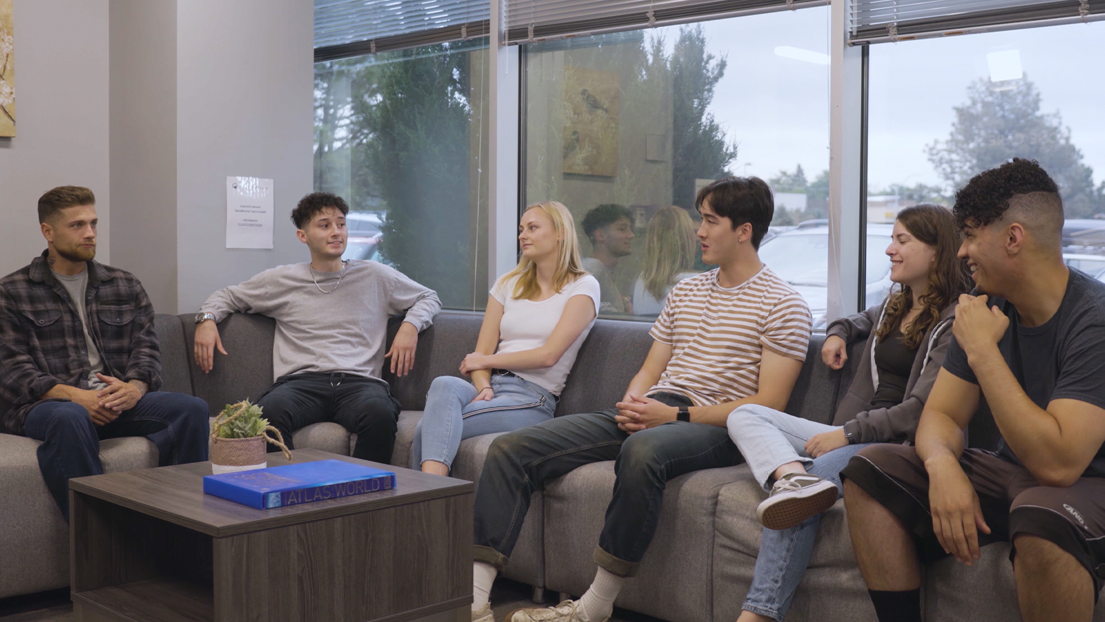 Discussion in a group therapy space with chairs in a  circle.