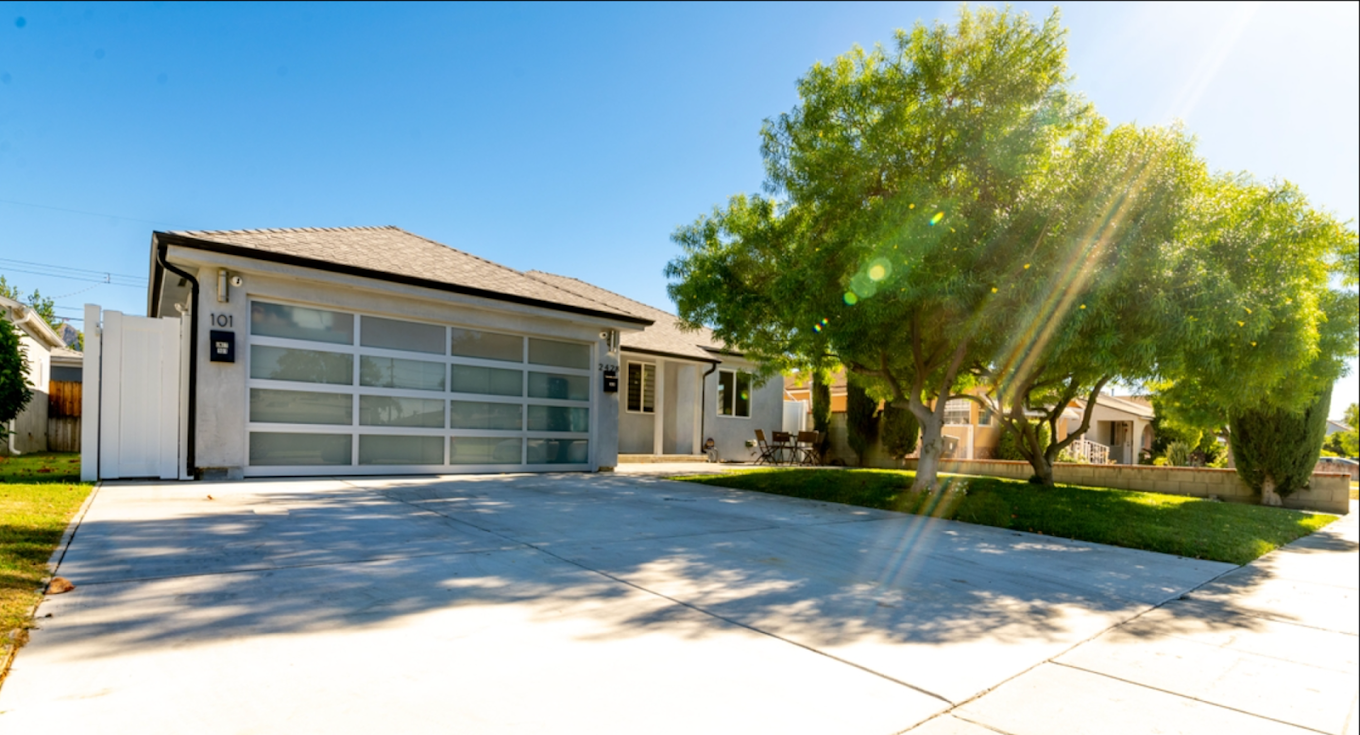 Modern residential treatment home with driveway
