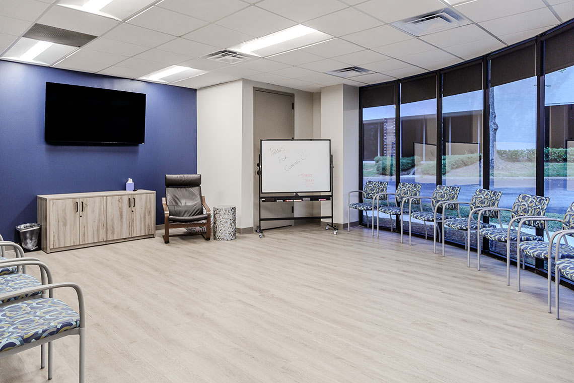 Open group room with chairs and whiteboard