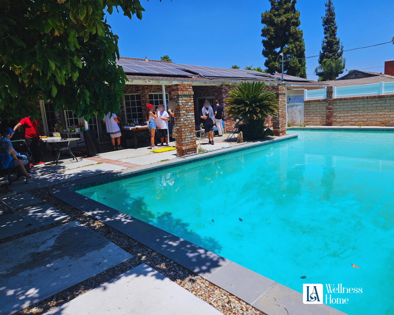 Outdoor swimming pool with patio seating
