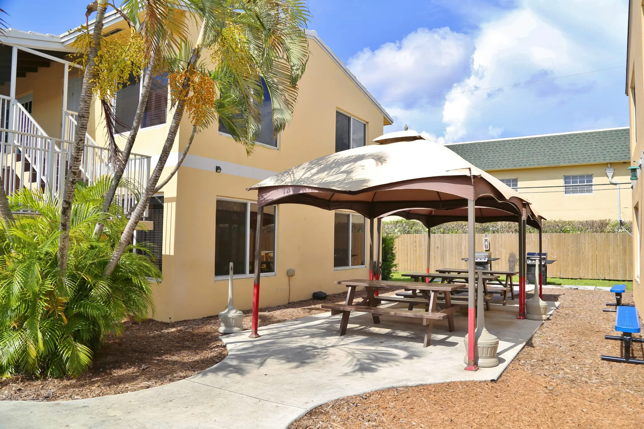 Covered patio with picnic tables and barbecue grills