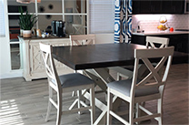 Dining table with four chairs near kitchen