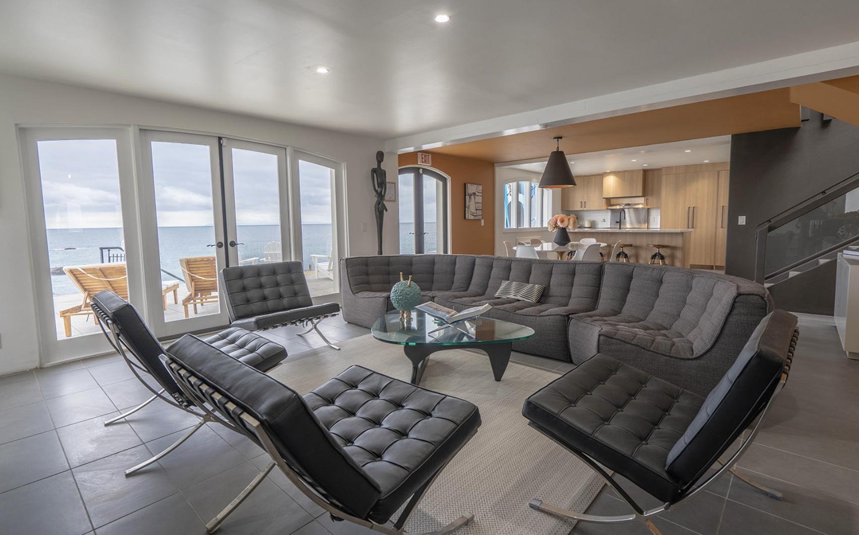Dining table and lounge area overlooking the ocean
