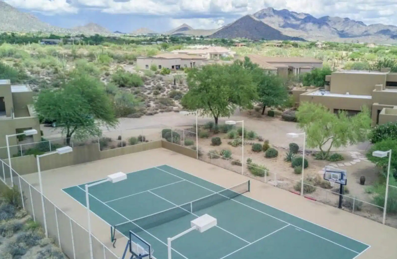 Outdoor basketball and tennis court with desert mountain views