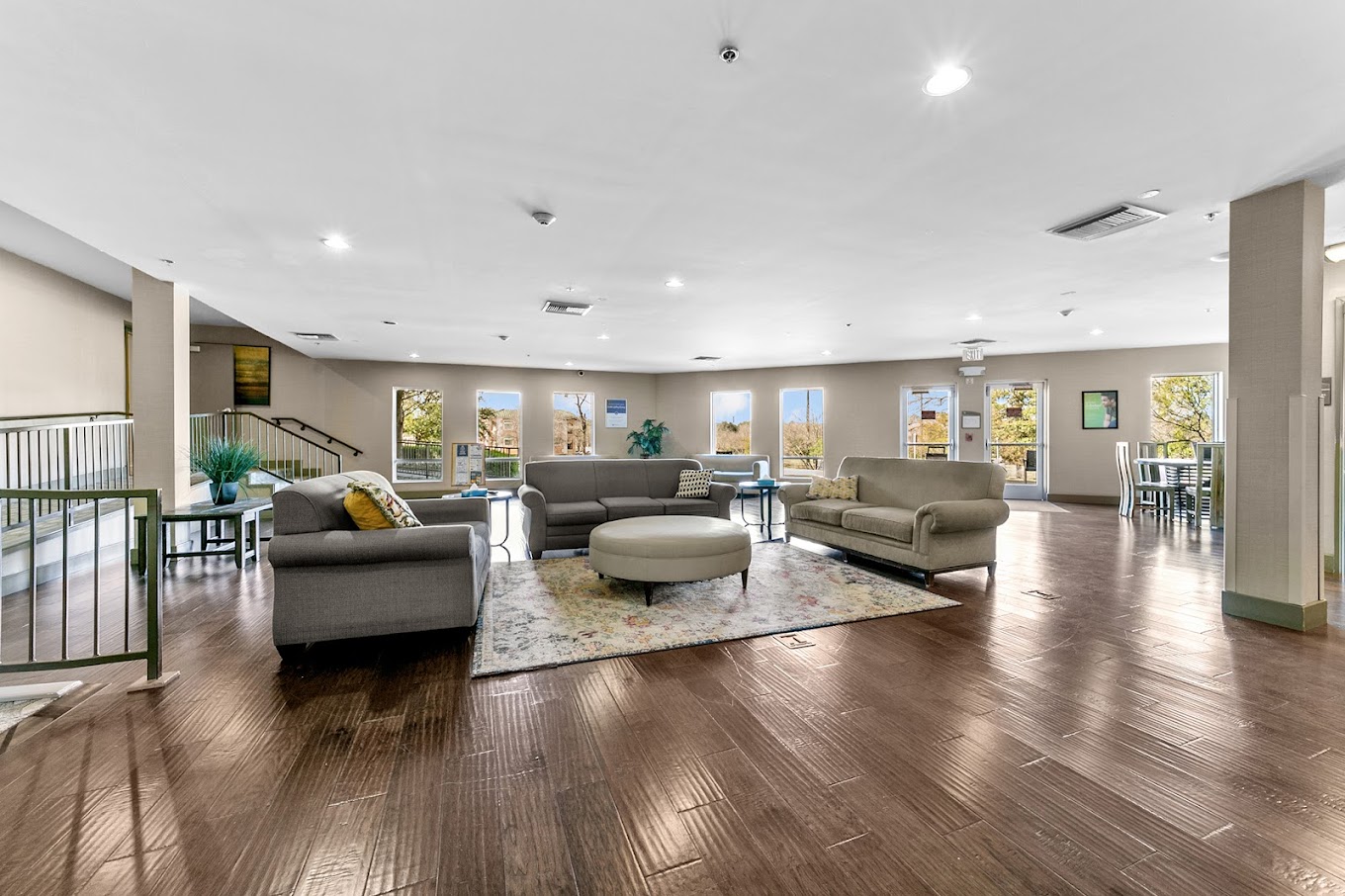 A rehab facility lounge with seating and bright windows.