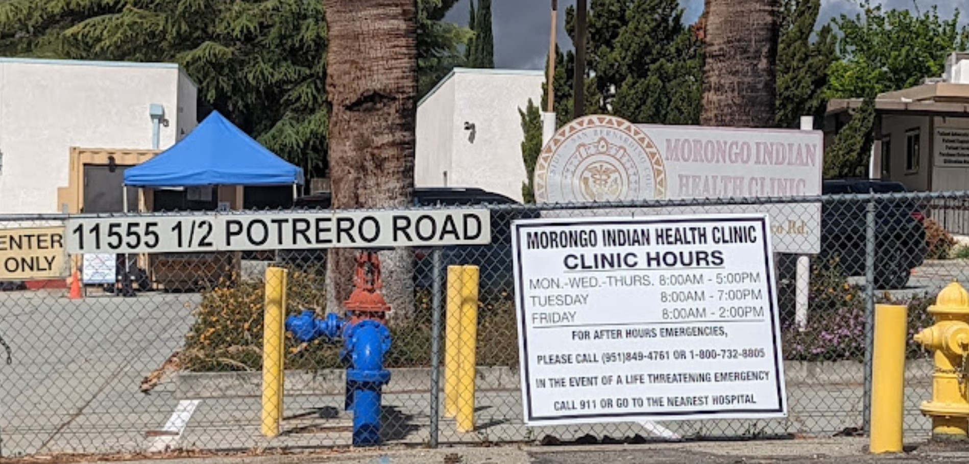 Street view of Riverside-San Bernardino County Morongo Clinic, showcasing the clinic’s location within a fenced area.