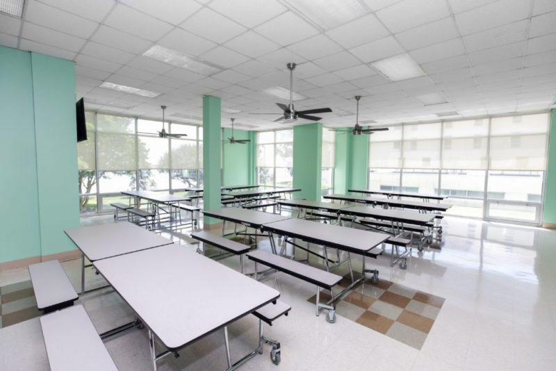 Bright dining room with tables and large windows