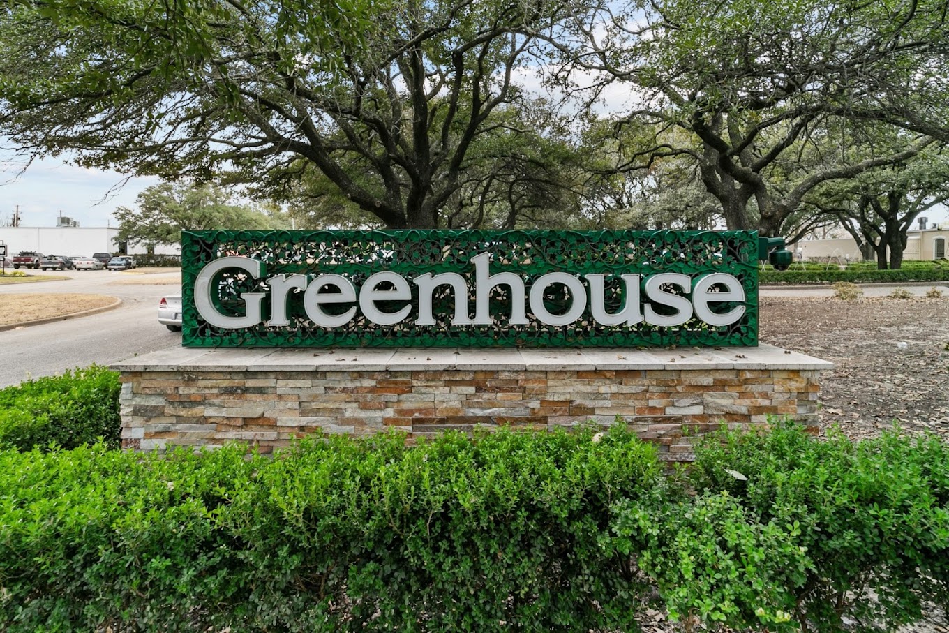  A large sign with "Greenhouse" at a rehab center entrance.