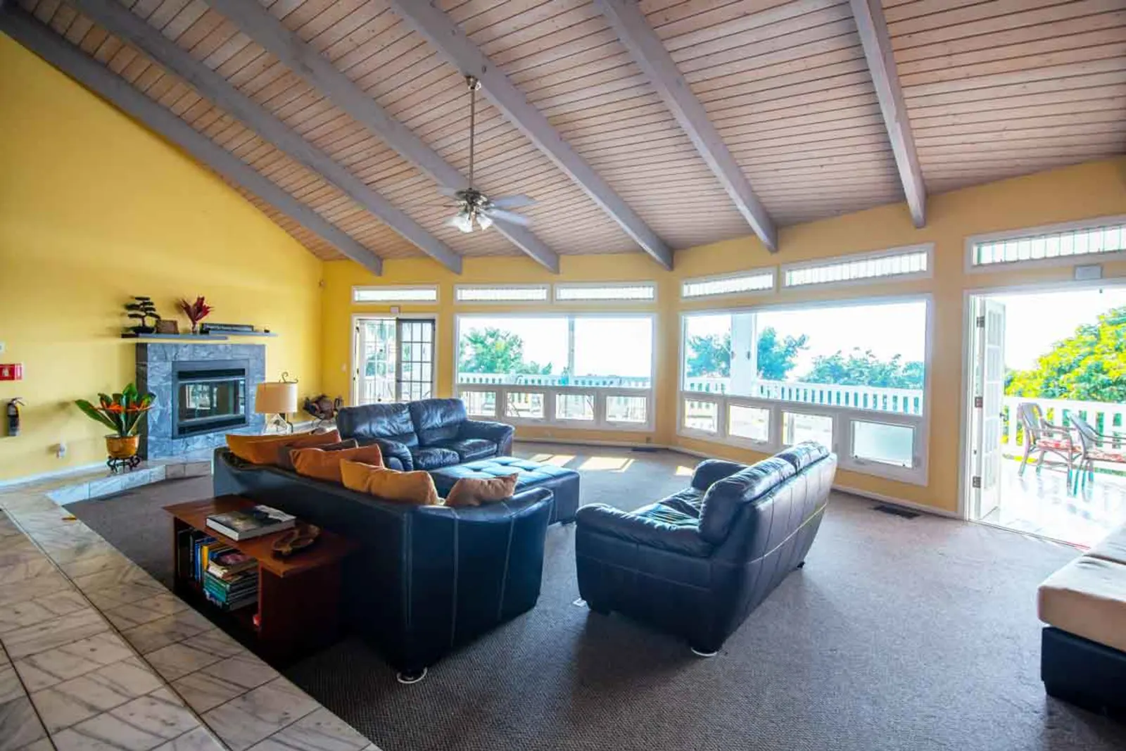 Cozy lounge with fireplace and leather sofas