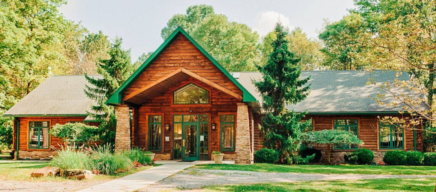 Front exterior of Saint Joseph Institute surrounded by trees