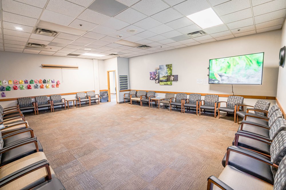 Group room with folding chairs and TV fireplace