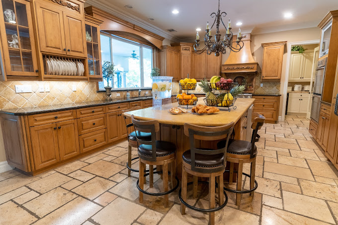 Gourmet kitchen with wood cabinets and island