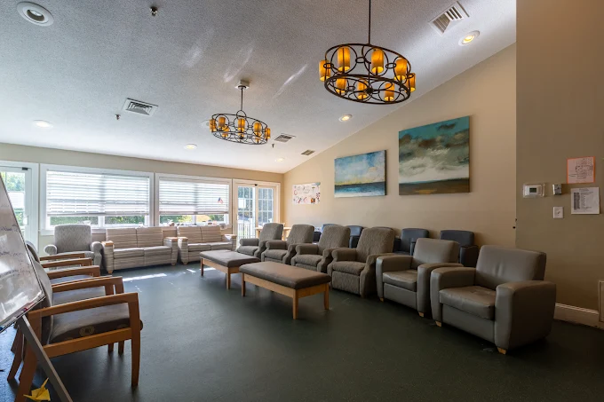Room with chairs arranged for group therapy sessions